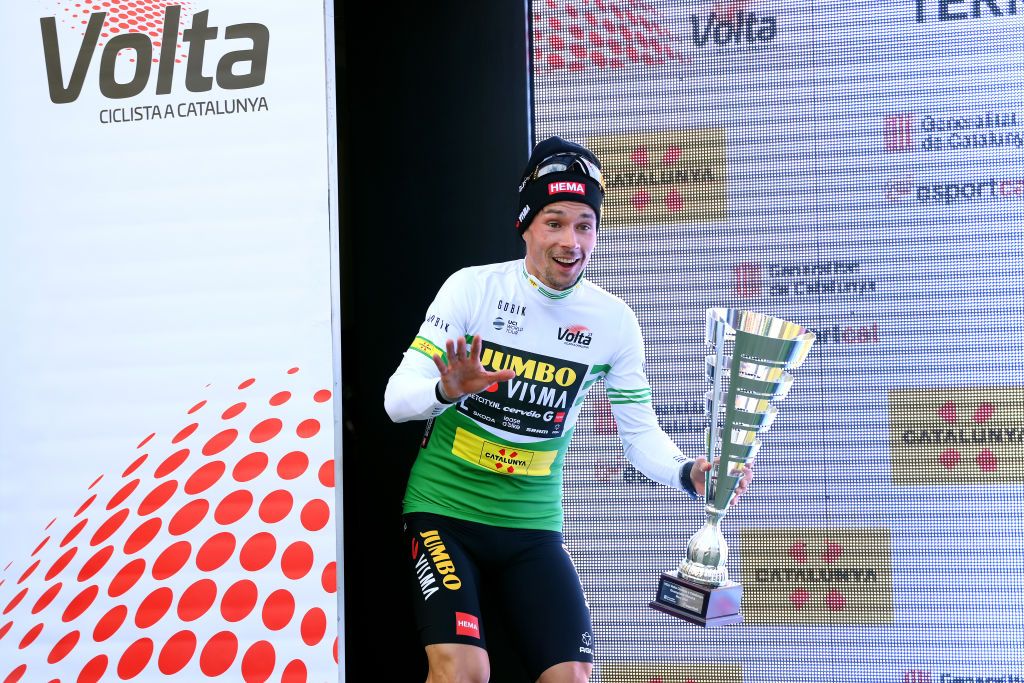 LO PORT SPAIN MARCH 24 Primoz Roglic of Slovenia and Team JumboVisma celebrates at podium as Green leader jersey winner during the 102nd Volta Ciclista a Catalunya 2023 Stage 5 a 1766km stage from Tortosa to Lo Port Mirador del Portell 1033m UCIWT on March 24 2023 in Lo Port Spain Photo by David RamosGetty Images