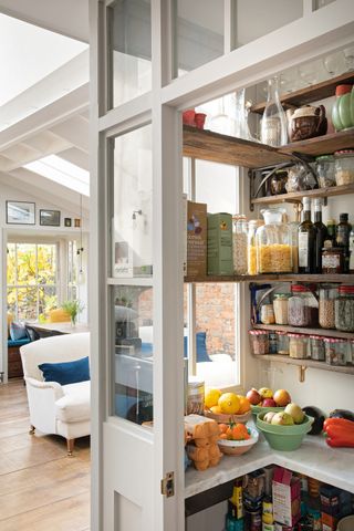 Small pantry with reclaimed shelves