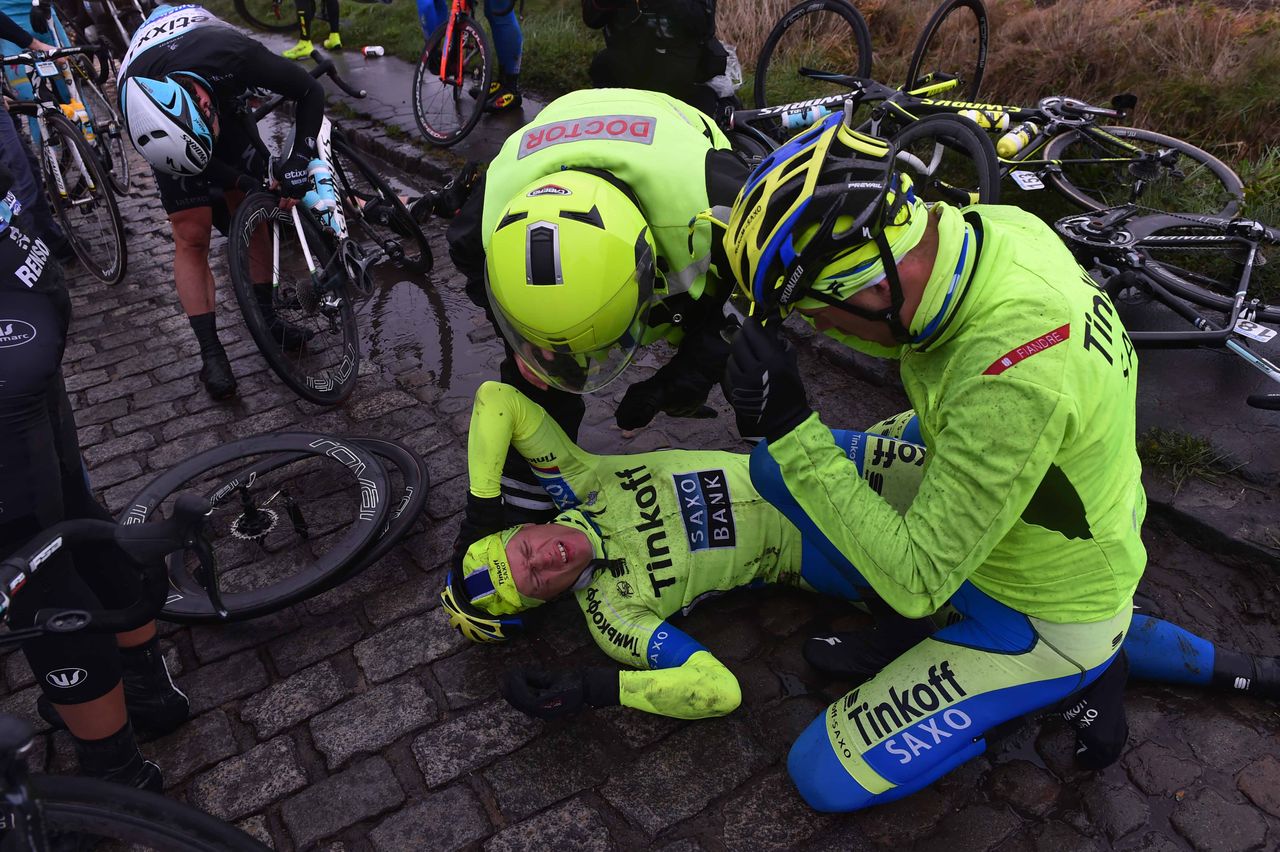 Matti Bresche's Tinkoff-Saxo teammates check on him after crashing