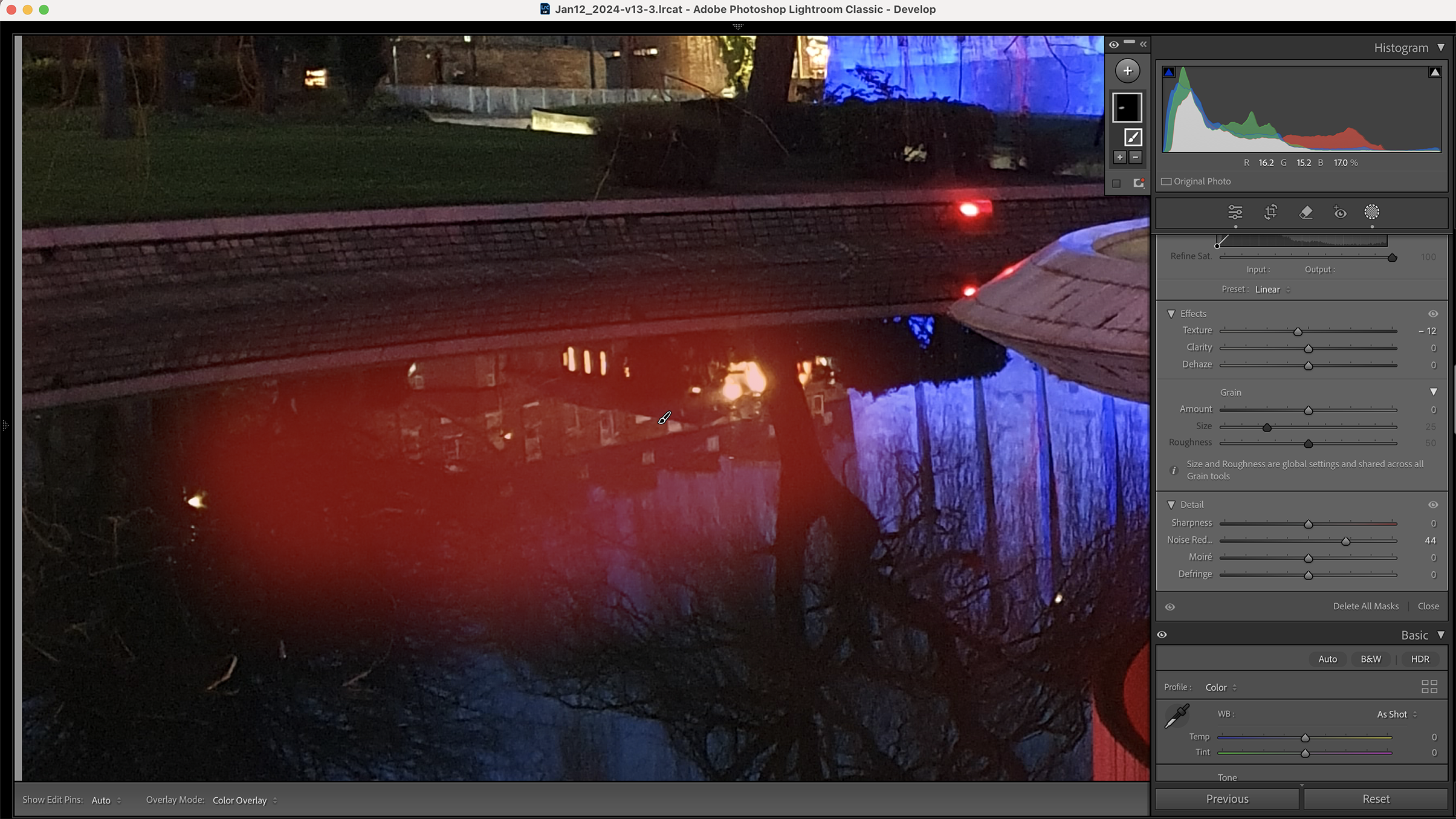 A dark, stylized image showcasing a modern building reflected in water, edited in Adobe Lightroom Classic with various adjustment panels visible