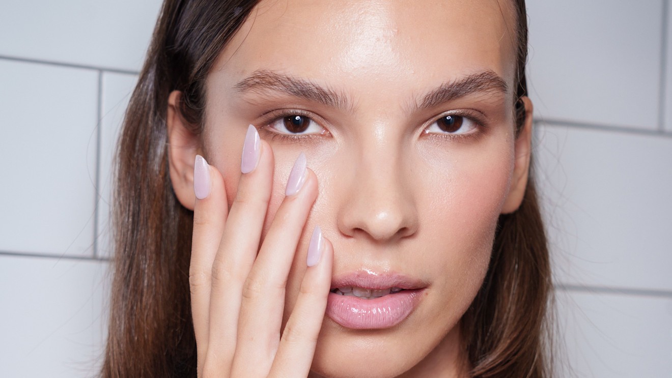 bridal nails against a brides face