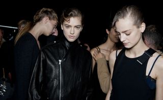 Female modelling a black leather jacket