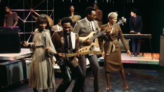 American band Chic, with members guitarist, music producer, songwriter, composer, and arranger, Nile Rodgers, bassist and also music producer, songwriter, and composer, Bernard Edwards, drummer Tony Thompson, and singers Luci Martin and Alfa Anderson.