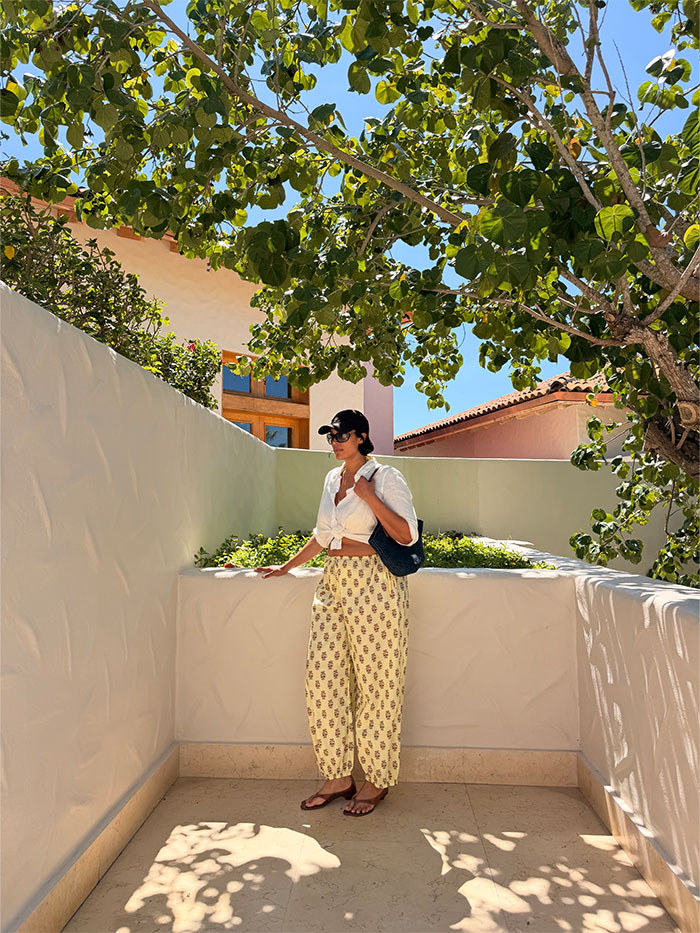 Jennifer Atilemile wearing a vacation outfit.
