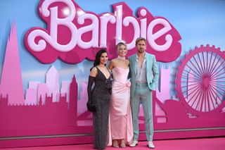 America Ferrera, Australian actress Margot Robbie and Canadian actor Ryan Gosling pose on the pink carpet upon arrival for the European premiere of "Barbie" in central London