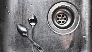 sink and sink plughole with spoons in it - how to unblock a sink methods