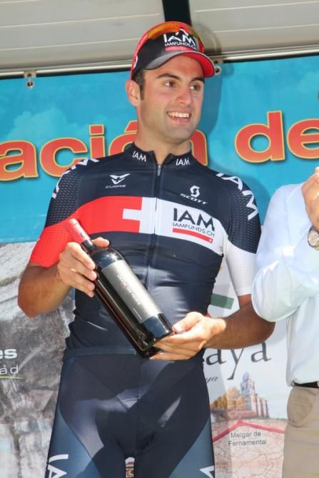Matteo Pelucchi (IAM) earns a bottle of wine as prize for his victory