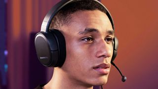 Hero image for best headsets and headphones for working from home showing young man wearing headphones