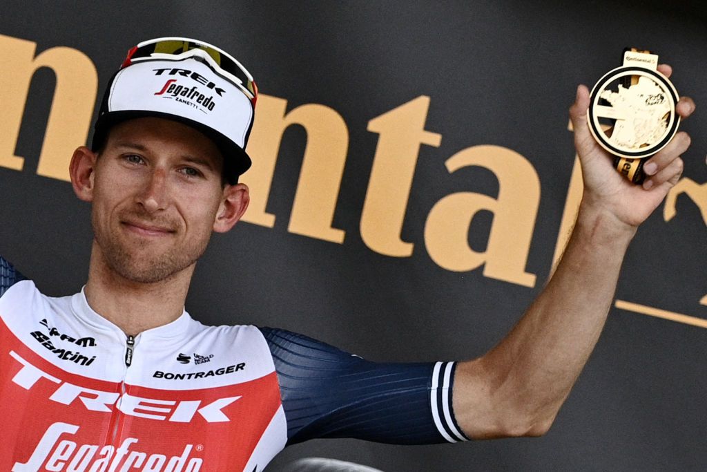 Stage winner Team Trek Segafredos Bauke Mollema of Netherlands celebrates on the podium after winning the 14th stage of the 108th edition of the Tour de France cycling race 183 km between Carcassonne and Quillan on July 10 2021 Photo by AnneChristine POUJOULAT AFP Photo by ANNECHRISTINE POUJOULATAFP via Getty Images