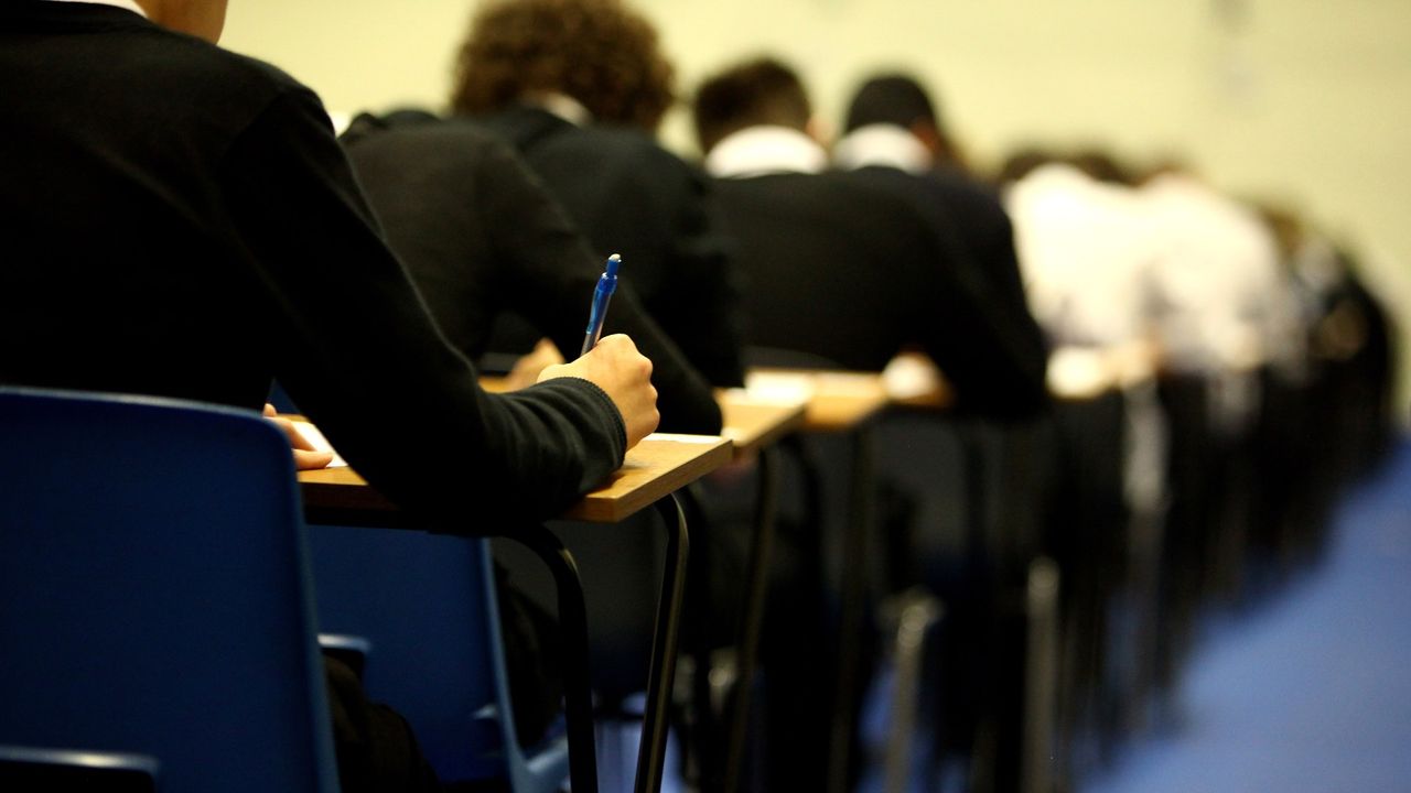 Pupils sit a pen and paper exam 