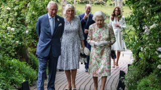 Britain's Prince Charles, Prince of Wales (L), Britain's Camilla, Duchess of Cornwall (C) and Britain's Queen Elizabeth II (R) attend a reception with G7 leaders at The Eden Project in south west England on June 11, 2021.