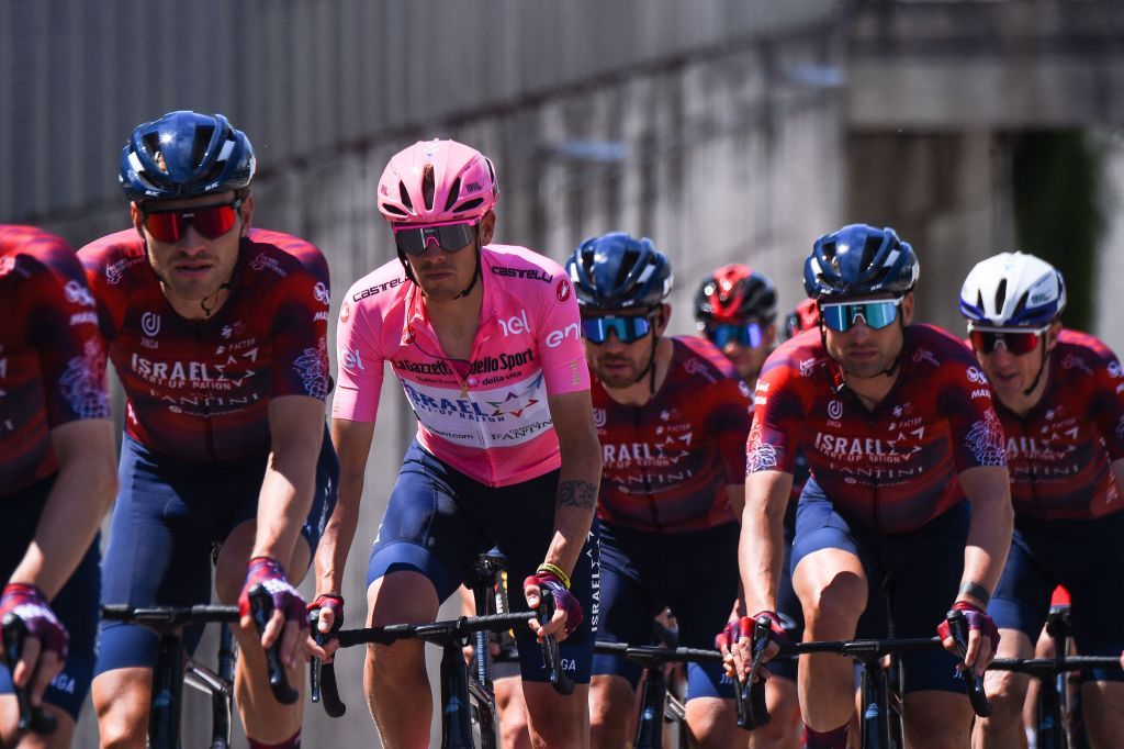 Team Israel StartUp Nation and overall leaders pink jersey teammate Italys Alessandro De Marchi ride during the fifth stage of the Giro dItalia 2021 cycling race 177 km between Modena and Cattolica EmiliaRomagna on May 12 2021 Photo by Dario BELINGHERI AFP Photo by DARIO BELINGHERIAFP via Getty Images