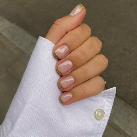 A close-up of an olive green French mani