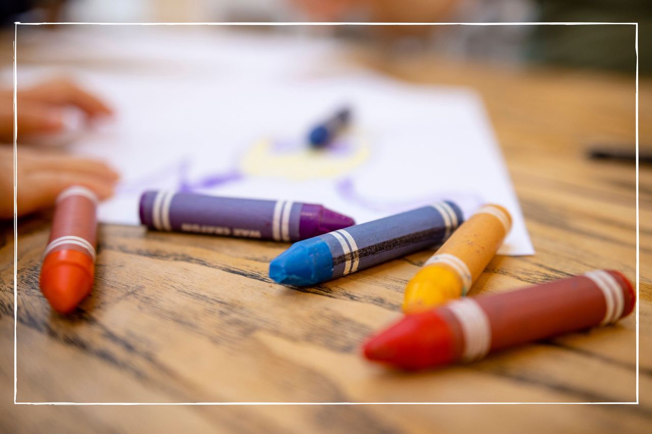 close up of multicoloured crayons on a wooden table