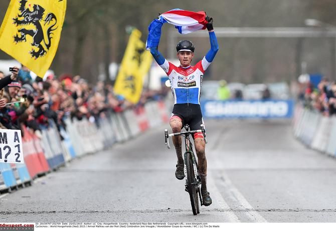 Mathieu van der Poel (BKCP-Powerplus) raises the Dutch flag at the finish line