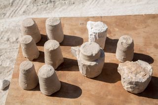 Here, chalkstone cores that were unearthed in a man-made cave in Galilee. The cores would have been worked on a lathe to make ritually pure storage vessels roughly 2,000 years ago.