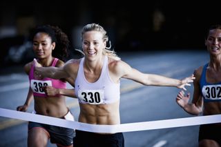 a woman winning a race