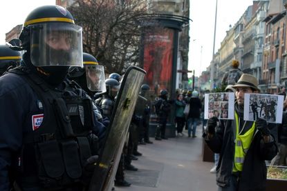Police and "yellow vest" protesters in France