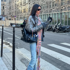 woman wearing light wash flare jeans