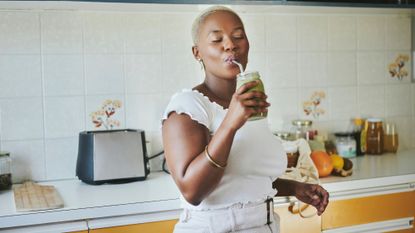 Cambridge diet: A woman chopping some green vegetables