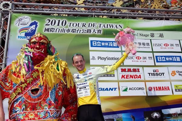 David McCann (Giant Asia) celebrates after his first full day of yellow