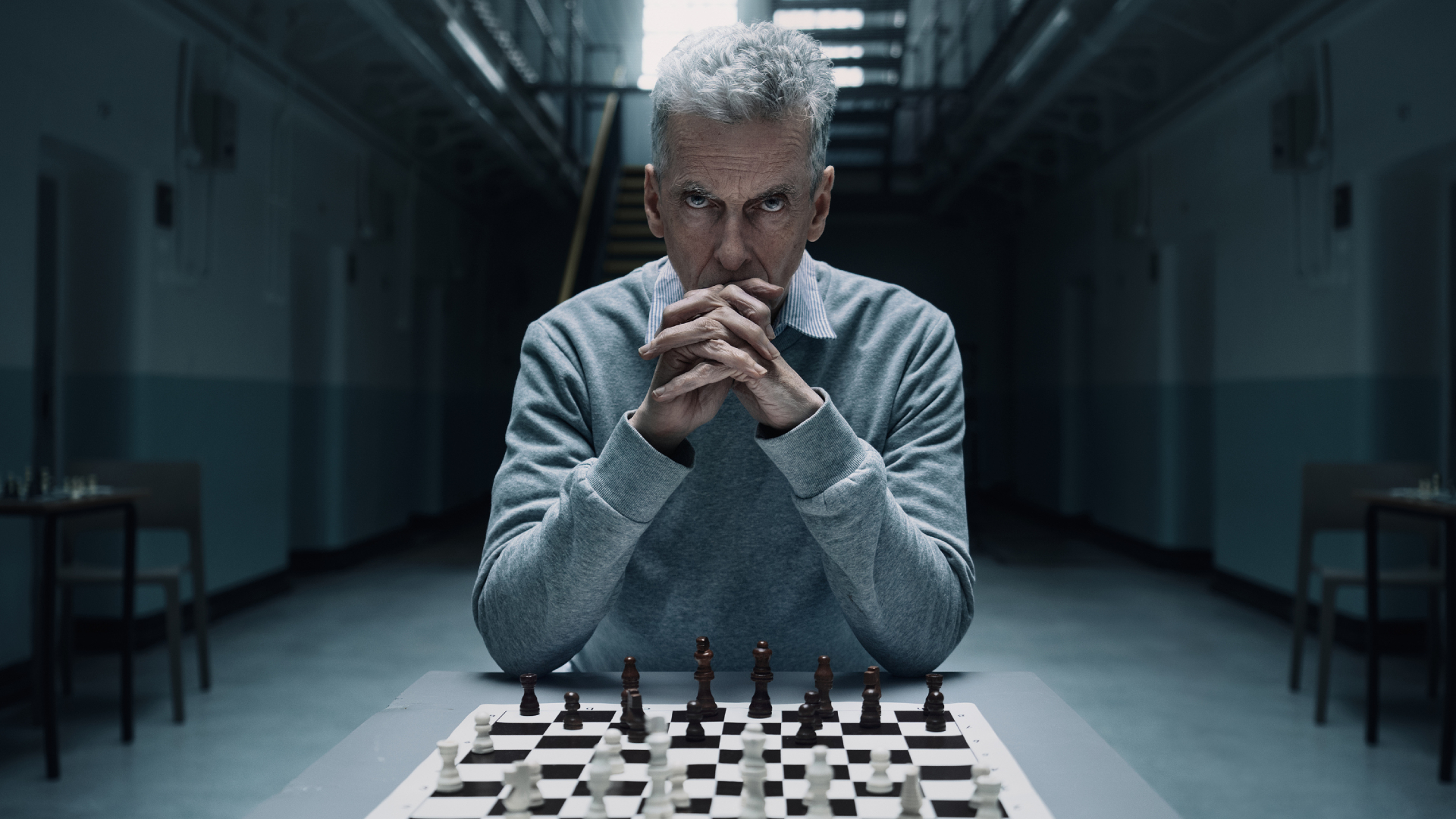 Peter Capaldi sitting in front of a chess board for The Devil's Hour