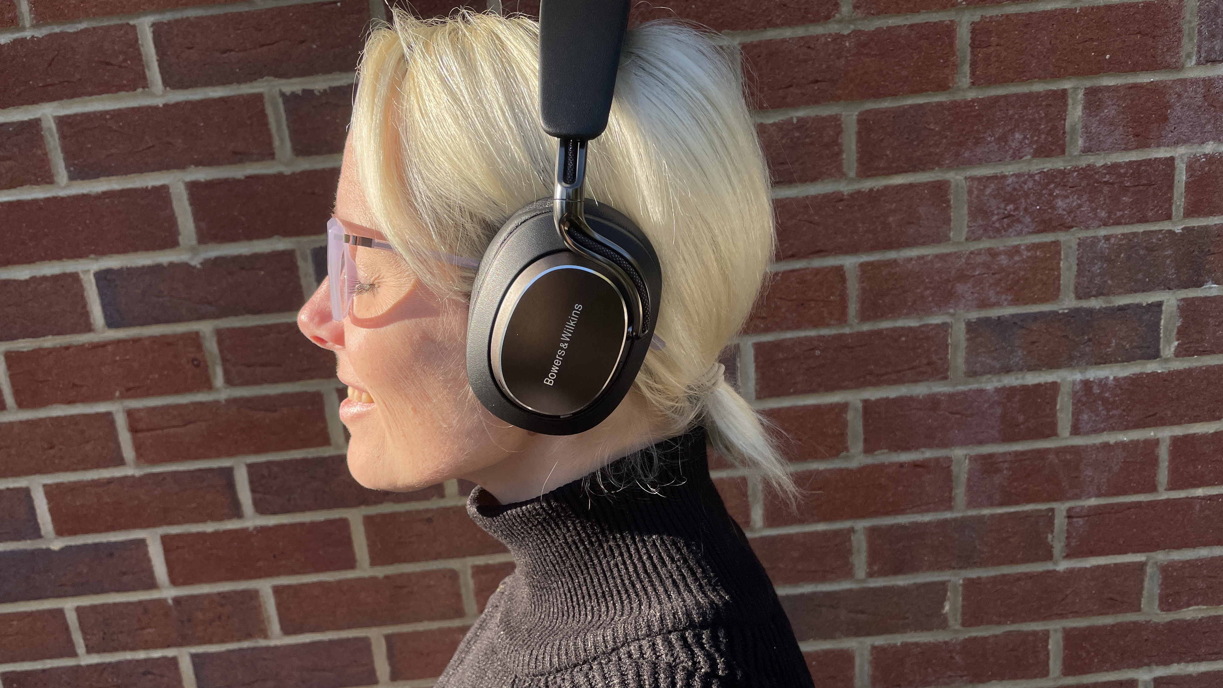 Bowers &amp;amp; Wilkins Px8 S2 in front of a red brick wall