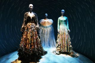 Two mannequins in dresses at The Fashion in India exhibition.