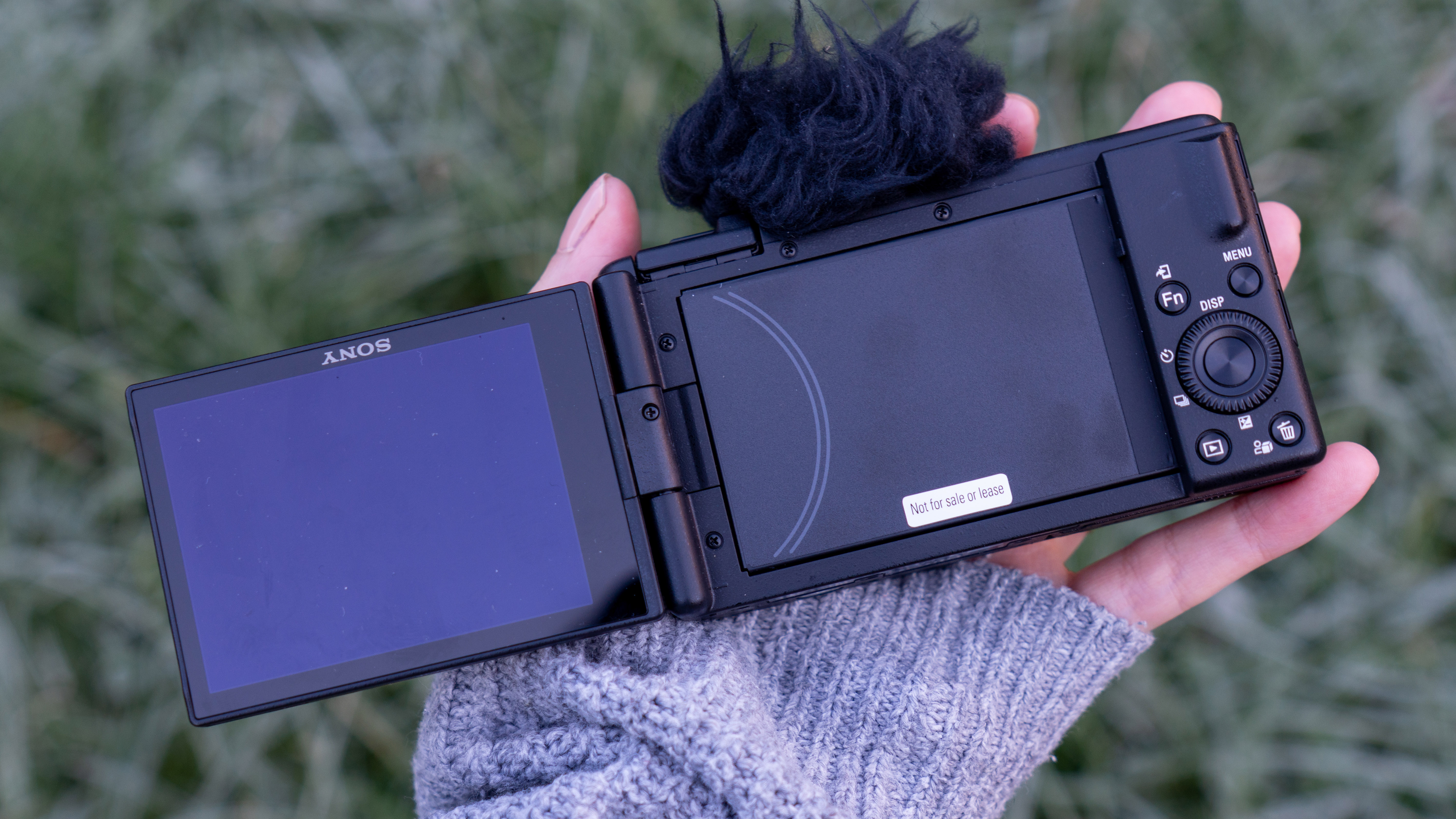 Sony ZV-F1 held in the hand showing back of the camera