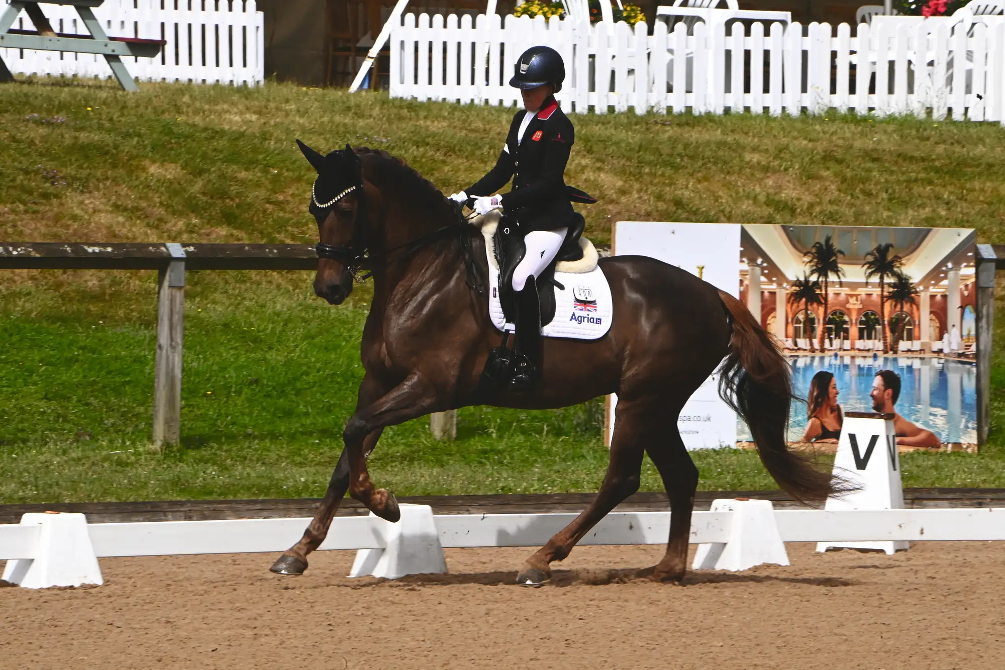 Nicola Naylor cantering around the dressage arena with Moulin Rouge
