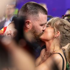 Travis Kelce celebrates and kisses Singer Taylor Swift following Super Bowl 58.