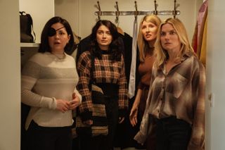 Sarah Greene, Eve Hewson, Sharon Horgan and Eva Birthistle as the garvey sisters hiding in a closet and looking surprised in bad sisters season 1 finale