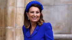 Carole Middleton, wearing royal blue, arrives for King Charles's coronation