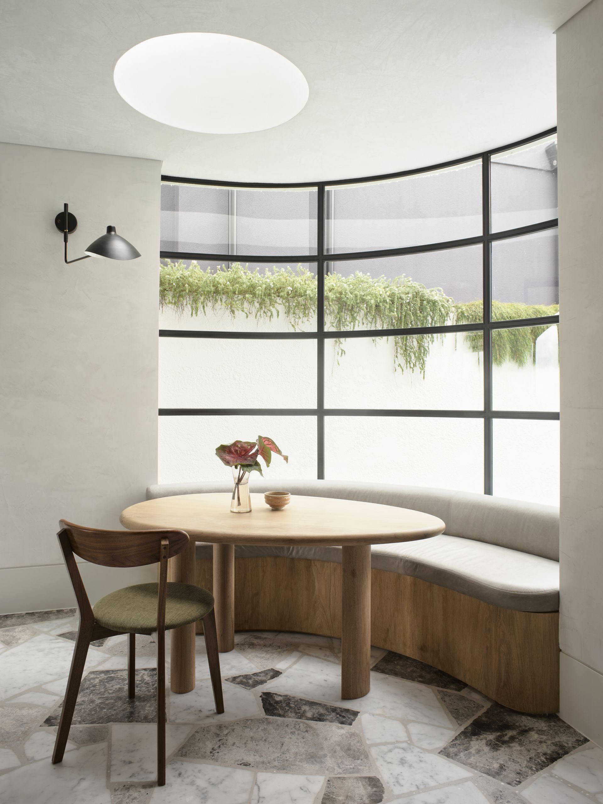 A breakfast nook with recessed lighting