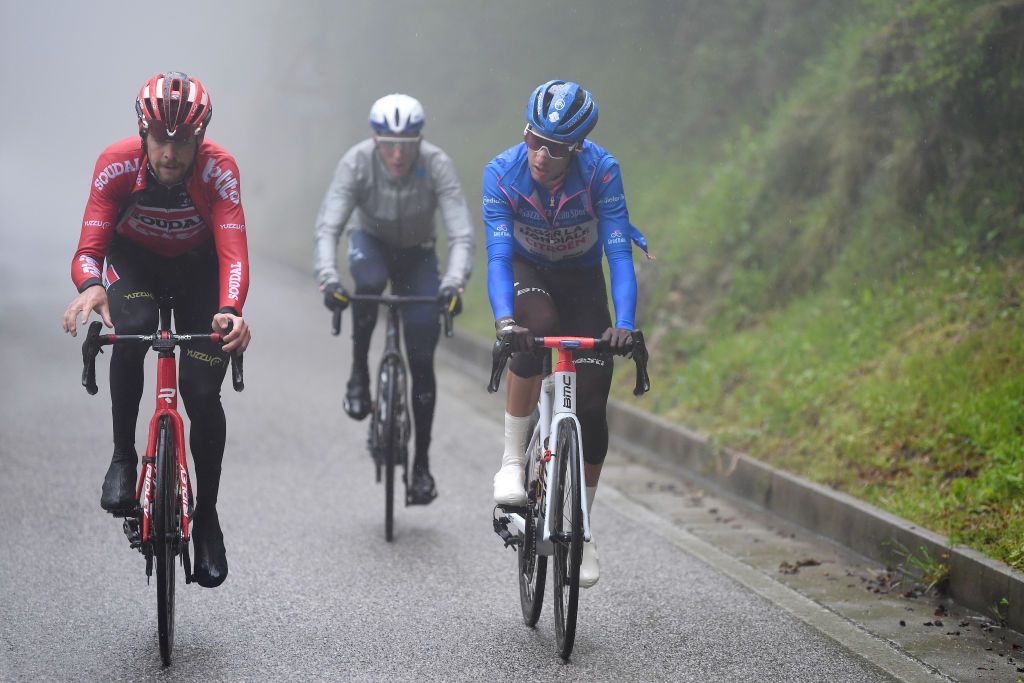 CORTINA DAMPEZZO ITALY MAY 24 Harm Vanhoucke of Belgium and Team Lotto Soudal Geoffrey Bouchard of France and AG2R Citren Team blue mountain jersey in breakaway during the 104th Giro dItalia 2021 Stage 16 a 153km stage shortened due to bad weather conditions from Sacile to Cortina dAmpezzo 1210m Fog Rain girodiitalia Giro on May 24 2021 in Cortina dAmpezzo Italy Photo by Tim de WaeleGetty Images