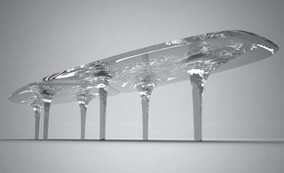 The new tables resemble plates of moving ice, complete with legs akin to furrowing tunnels of water, draining down from the surface