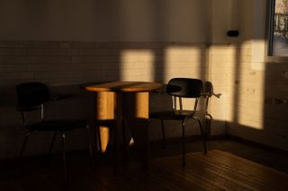Chair and table in half shadow
