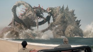 Titan X and Godzilla fighting as two humans watch on in Monarch: Legacy of Monsters season 2 episode 8