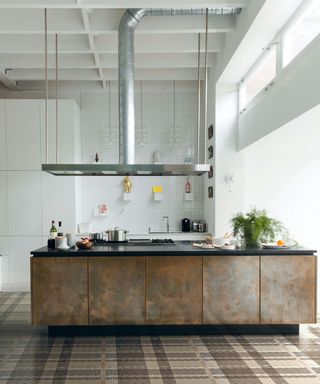 Modern kitchen with large stainless steel extractor hood