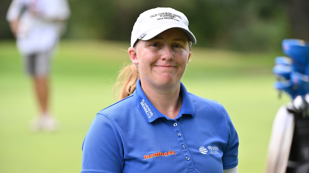 Gemma Dryburgh wearing a blue polo and white cap during an LPGA event