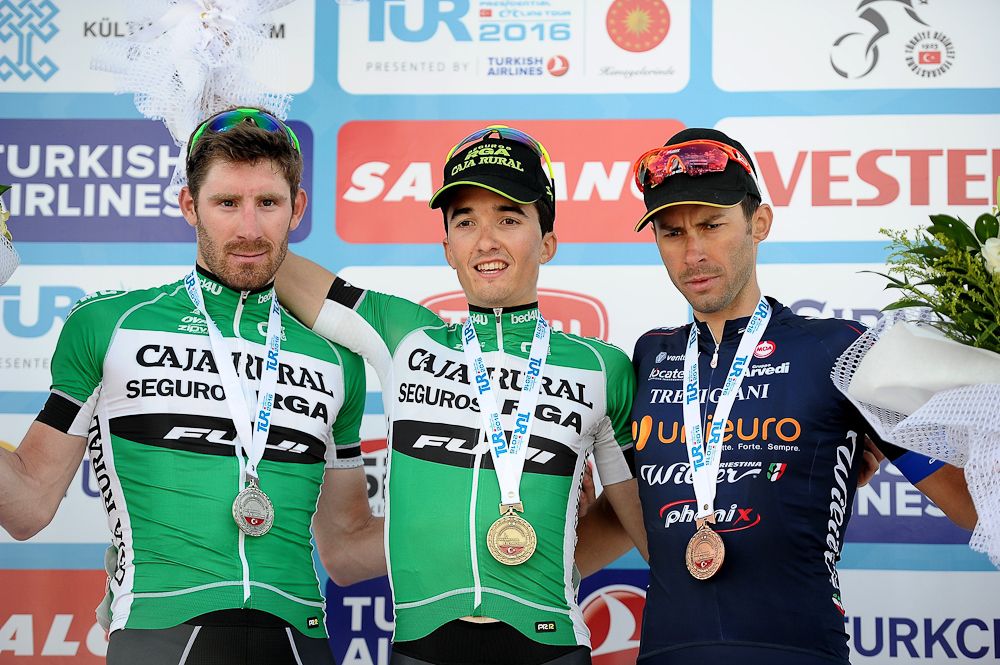 Jose Goncalves of Caja Rural-Seguros RGA, Bilbao Lopez de Armentia Pello of Caja Rural-Seguros RGA, and Mauro Finetto of Unieuro Wilier celebrate on the stage 2 podium at Tour of Turkey
