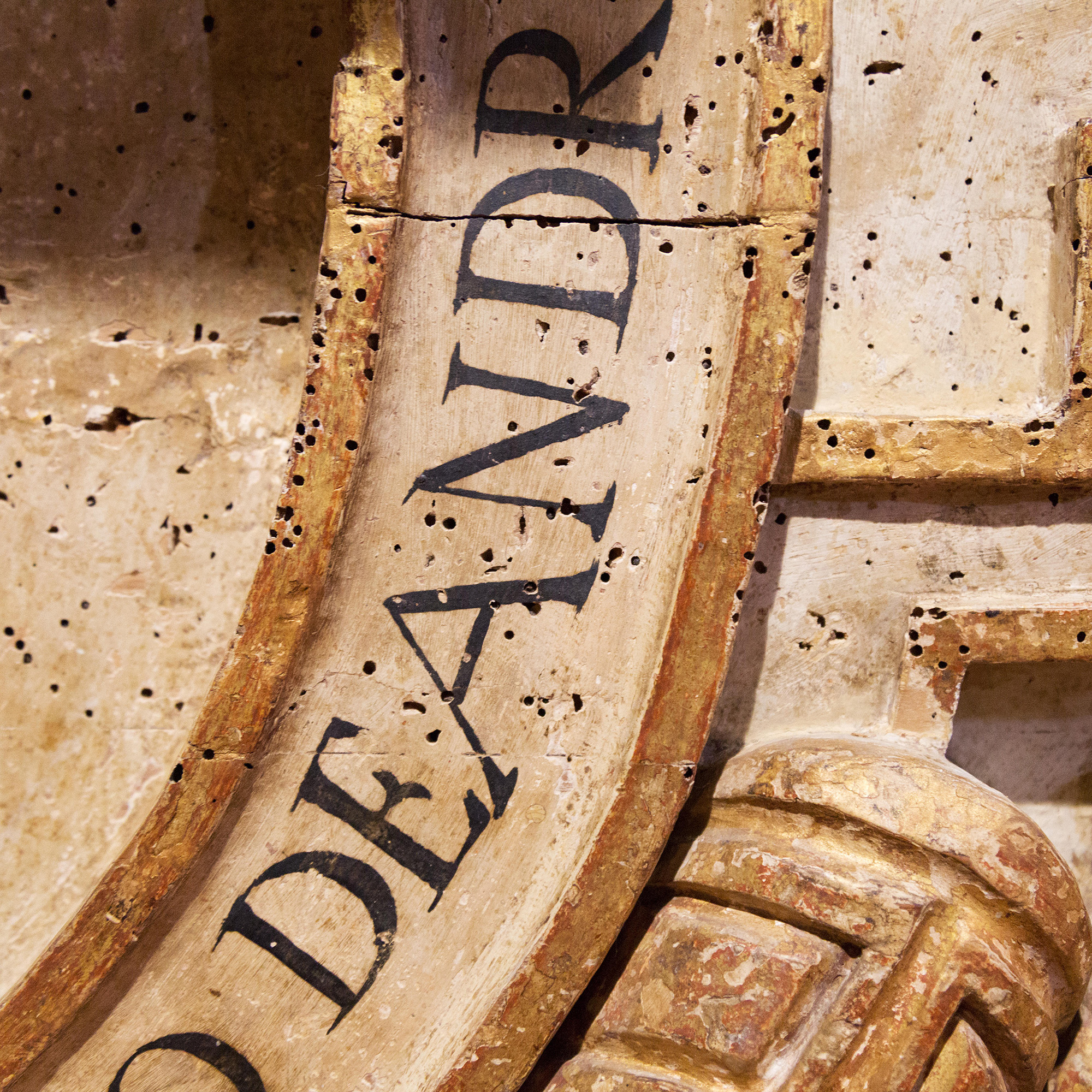 Woodworm in church - close up of woodworm holes in wooden decoration in a church, South America