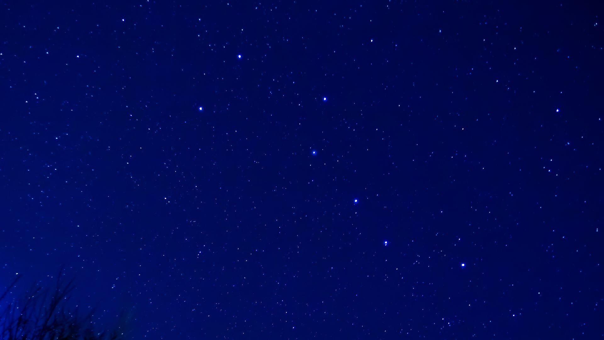 A picture of the night sky showing the bright stars of the Big Dipper asterism, which form part of the constellation Ursa Major.