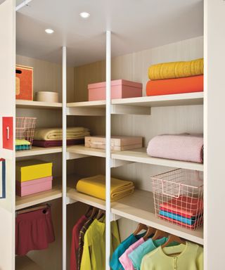 walk-in closet interior, showing shelves, clothes rail and lighting