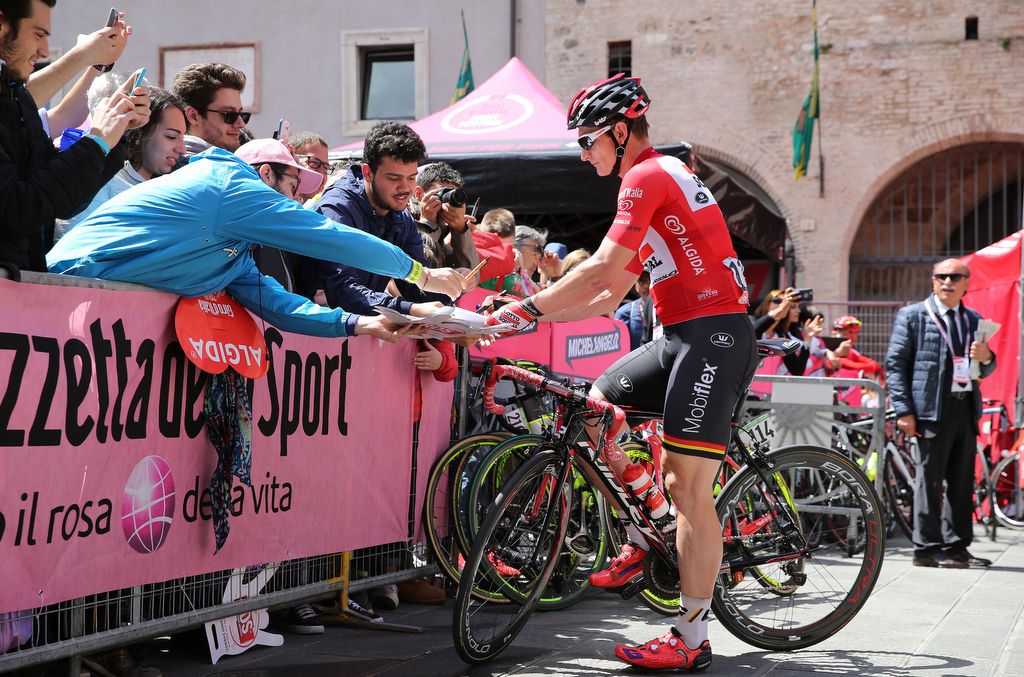 Points leader Andre Greipel signs autographs for the fans