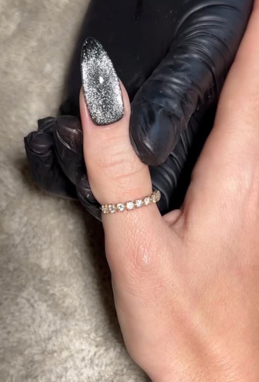a close-up shot of black velvet nails
