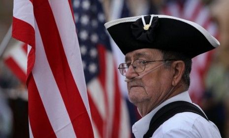 Tea Party activist Roy Allen listens to political speeches in Fort Collins, Colorado. 