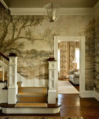 Entry hall and stairs with mural wallpaper with country theme