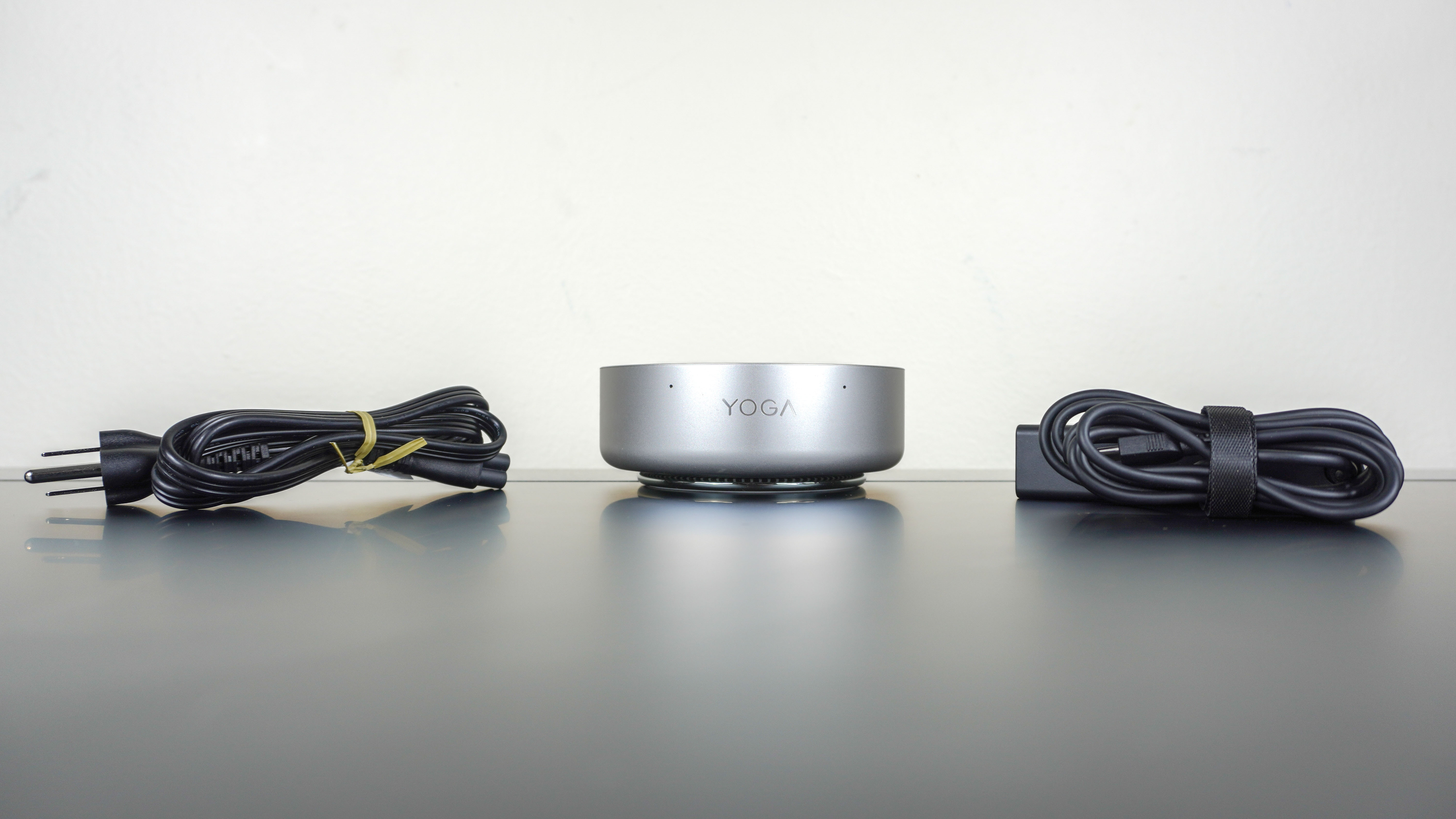 The Lenovo Yoga Mini mini PC unboxed on a desk