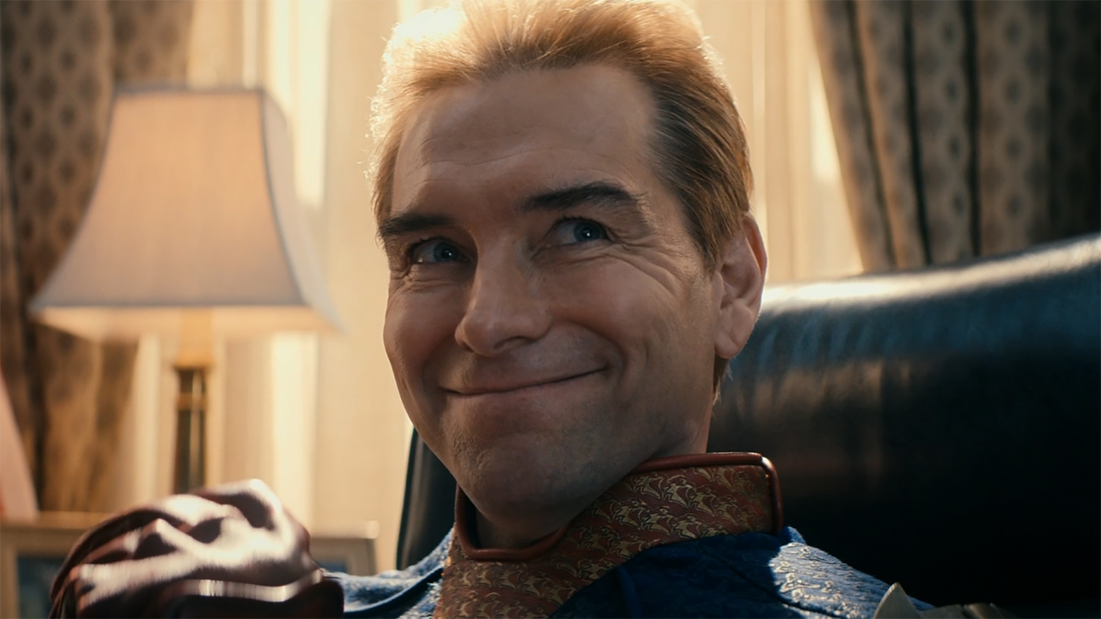 A close up of Homelander smiling in The Boys season 5 episode 8